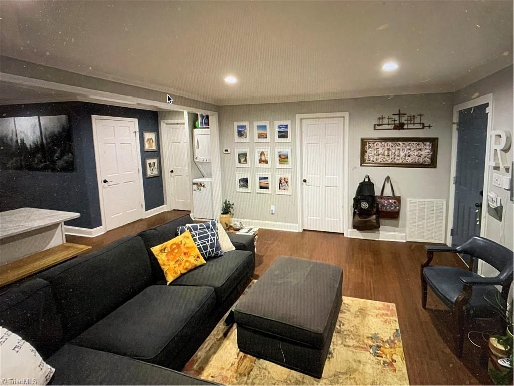 7741 Cedar Square Road Randleman, NC 27317 - Photo 6 of 18 Large living room thats open. New interlacing flooring throughout the living space.