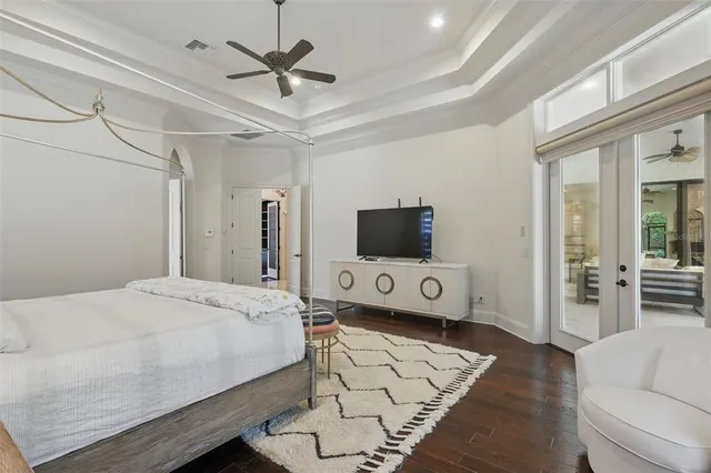 a spacious bathroom with a tub sink and mirror