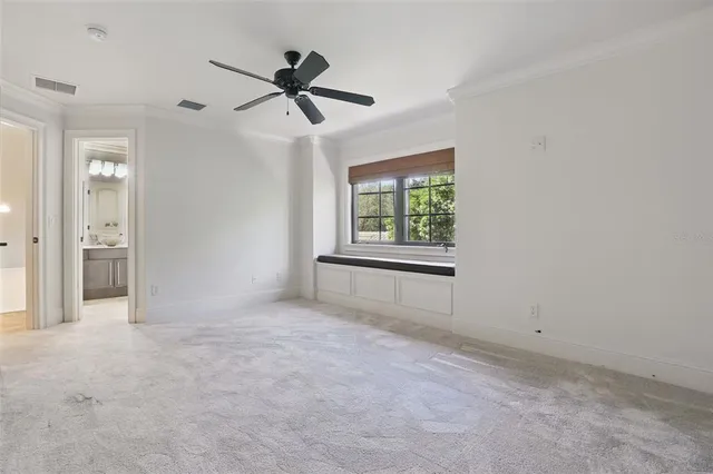 a bathroom with a granite countertop sink a toilet a mirror and shower