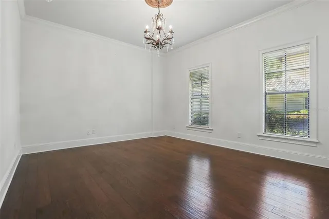 a view of hall way with furniture and large window