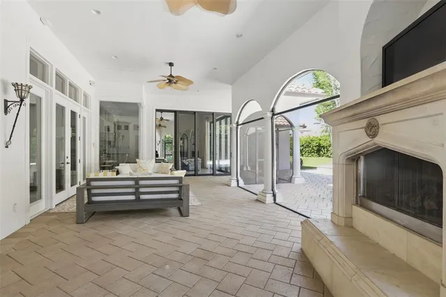 a large kitchen with a large window and cabinets
