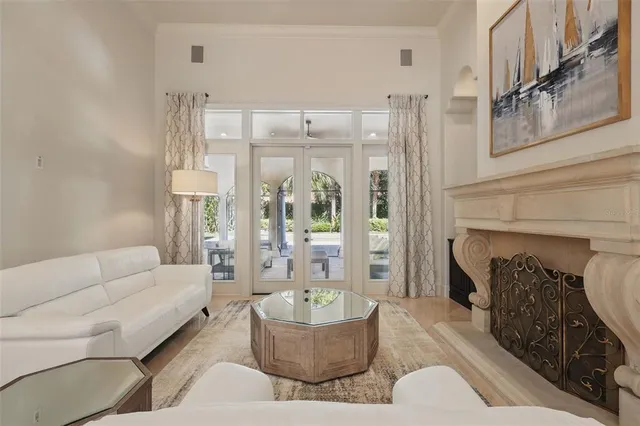 a view of a dining room with furniture and chandelier