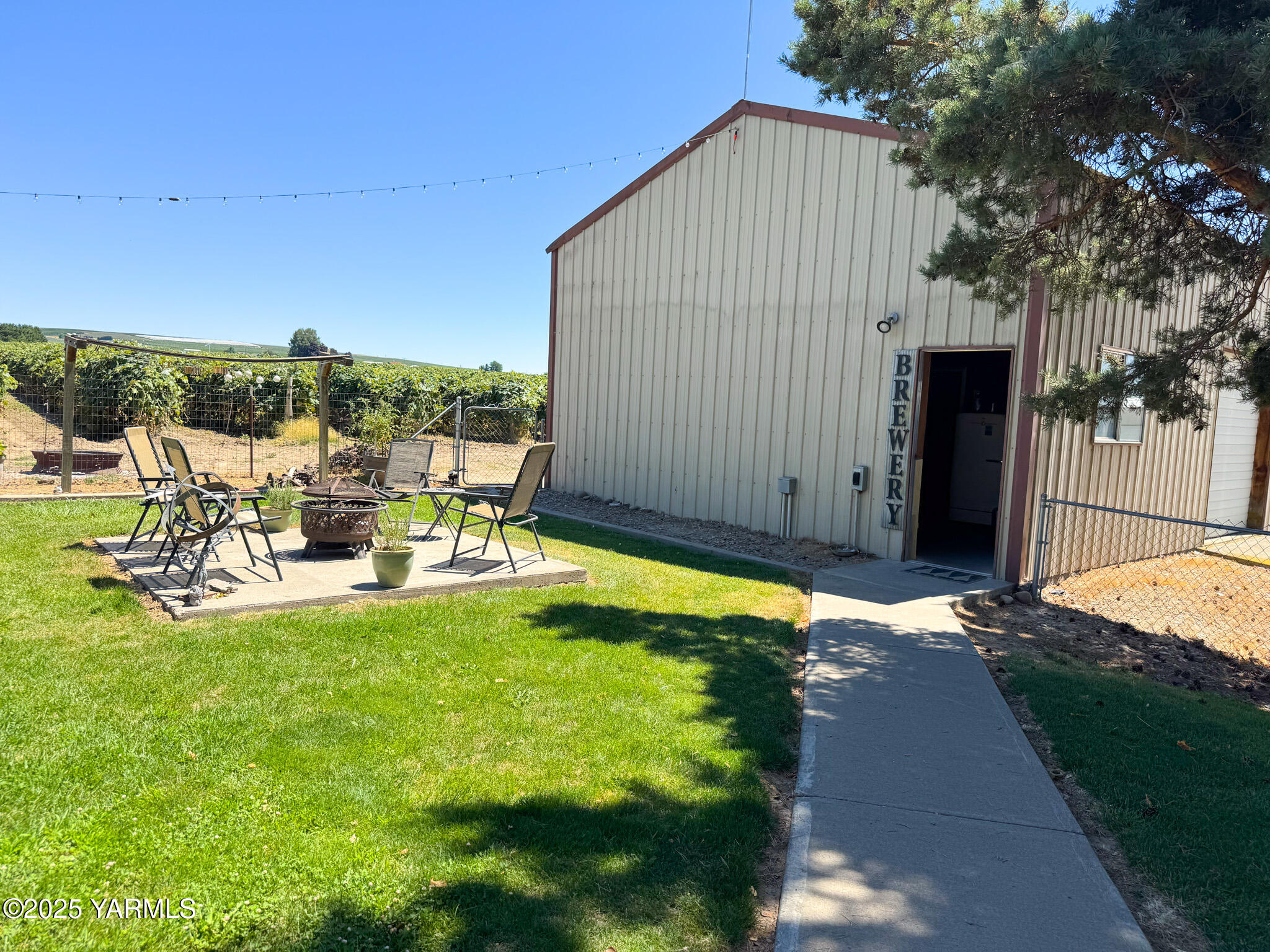 3321 Bethany Road Sunnyside, WA 98944 - Photo 16 of 24 a view of backyard of house with seating space