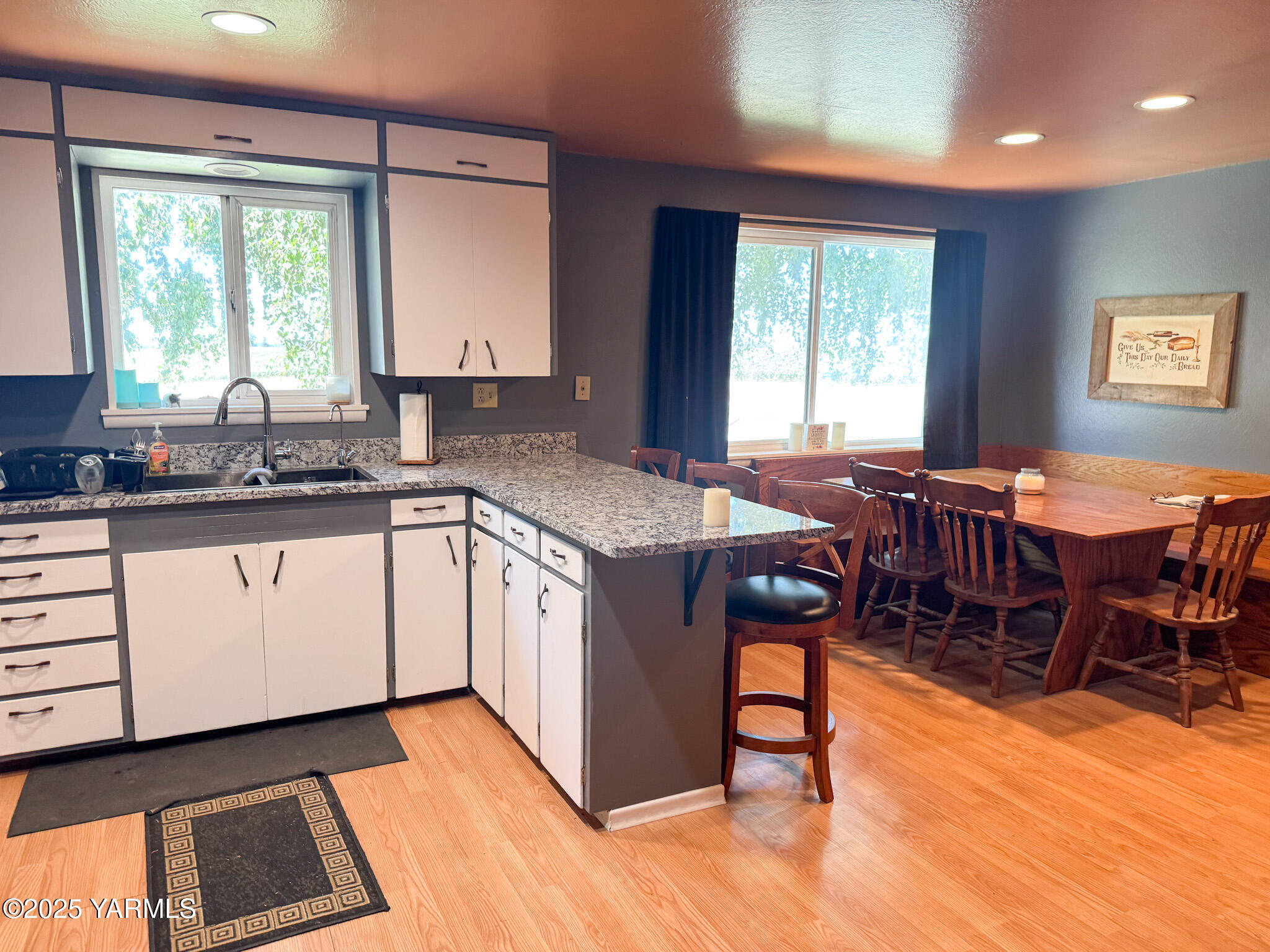 3321 Bethany Road Sunnyside, WA 98944 - Photo 9 of 24 a kitchen with stainless steel appliances granite countertop a stove a sink and a microwave