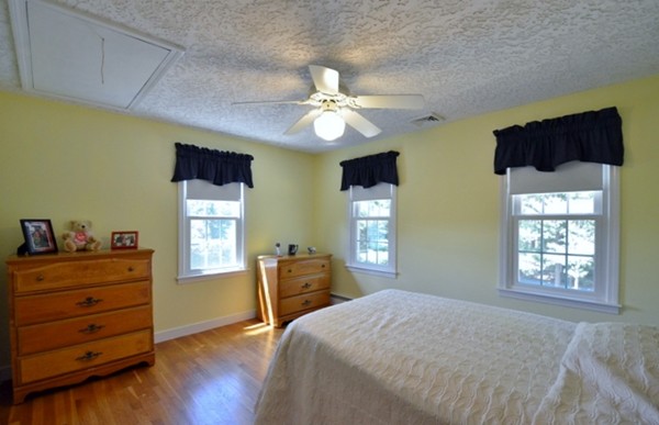 57 Green Road Bolton, MA 01740 - Photo 15 of 28 a bedroom with a bed and a dresser