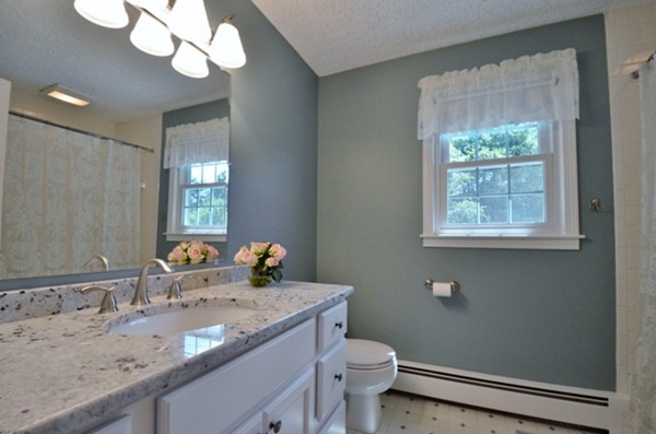 57 Green Road Bolton, MA 01740 - Photo 17 of 28 a bathroom with a granite countertop sink a toilet and a mirror
