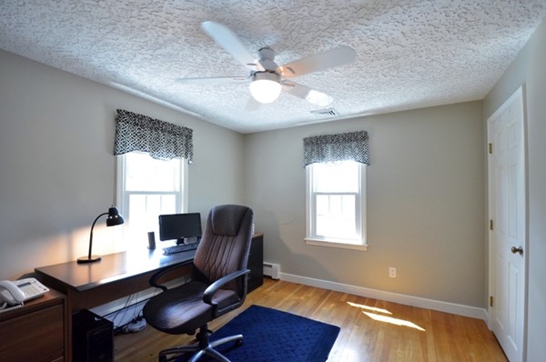 57 Green Road Bolton, MA 01740 - Photo 18 of 28 a view of a workspace with furniture and a window