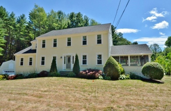 57 Green Road Bolton, MA 01740 - Photo 23 of 28 a front view of a house with a garden