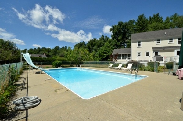 57 Green Road Bolton, MA 01740 - Photo 26 of 28 a view of a swimming pool with lounge chair
