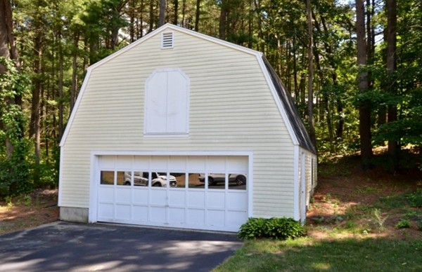 57 Green Road Bolton, MA 01740 - Photo 28 of 28 a view of a house with a yard and a garage