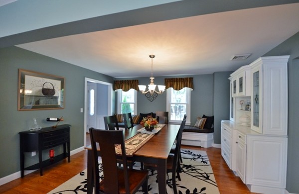 57 Green Road Bolton, MA 01740 - Photo 5 of 28 a view of a dining room with furniture window and wooden floor