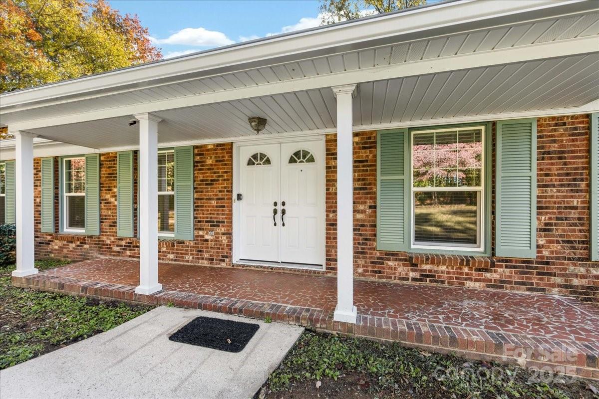 1840 Stoneyridge Drive Charlotte, NC 28214 - Photo 2 of 44 a front view of a house with a porch