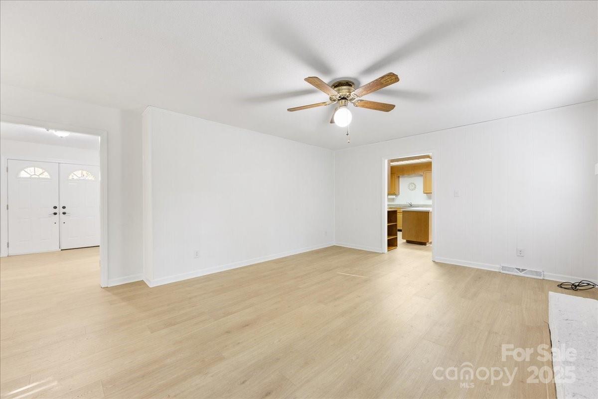 1840 Stoneyridge Drive Charlotte, NC 28214 - Photo 21 of 44 an empty room with a empty space and a ceiling fan