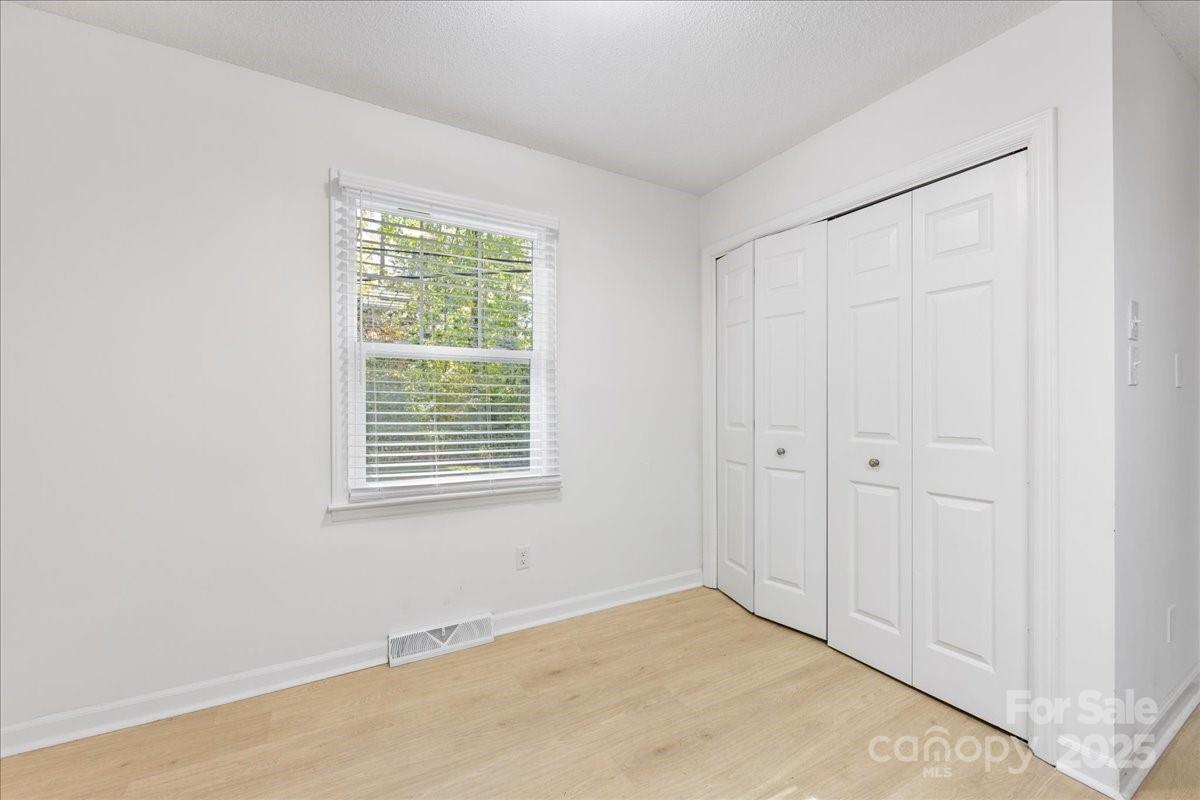 1840 Stoneyridge Drive Charlotte, NC 28214 - Photo 24 of 44 a view of an empty room with a window