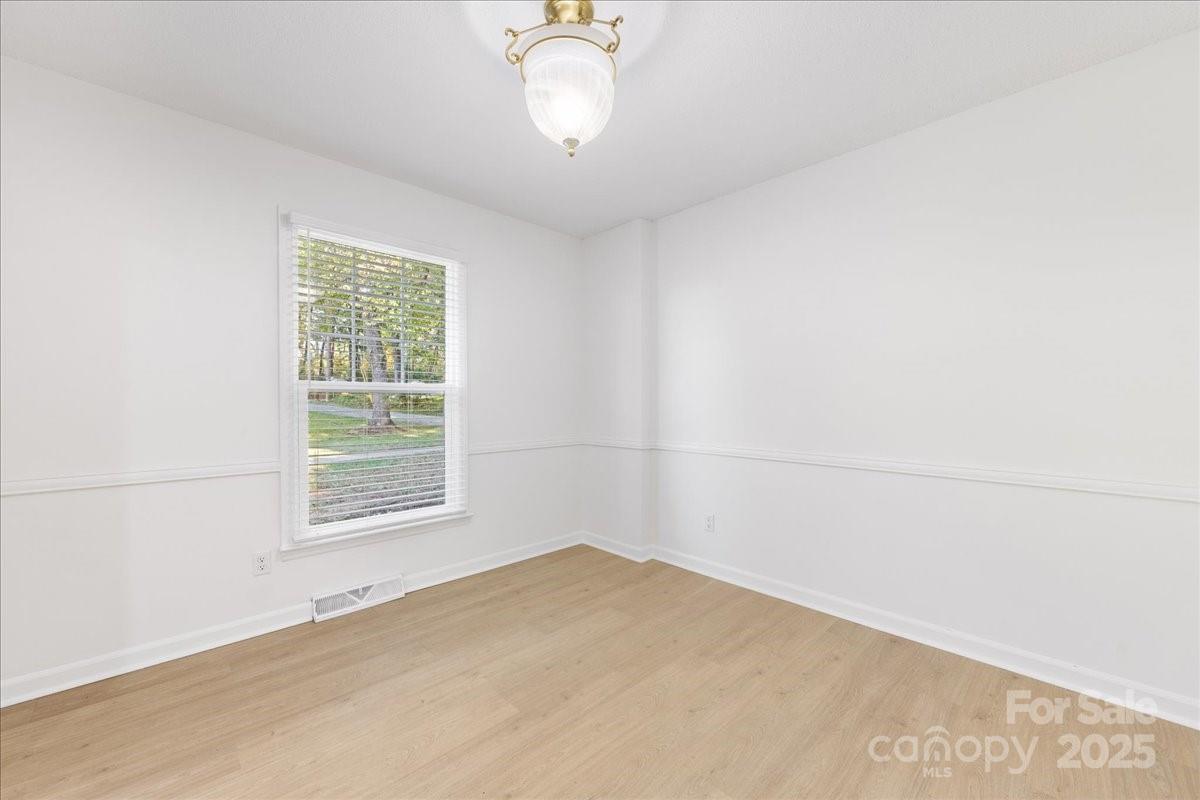 1840 Stoneyridge Drive Charlotte, NC 28214 - Photo 35 of 44 an empty room with a window