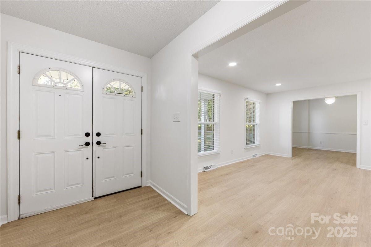 1840 Stoneyridge Drive Charlotte, NC 28214 - Photo 41 of 44 an empty room with windows and closet