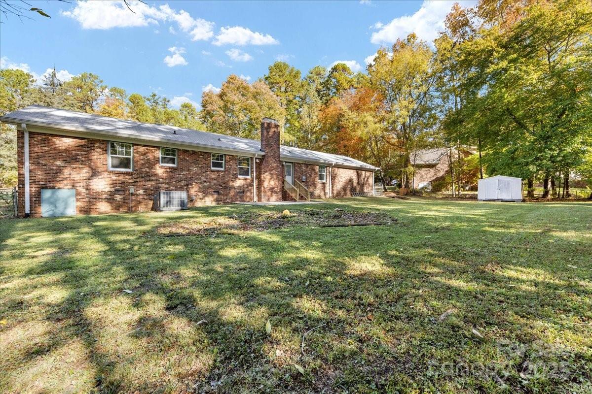 1840 Stoneyridge Drive Charlotte, NC 28214 - Photo 43 of 44 a backyard of a house with lots of green space