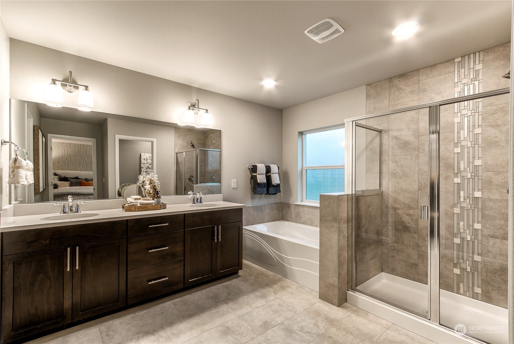 21116 42nd Drive Southeast, Unit 125 Bothell, WA 98021 - Photo 15 of 16 a bathroom with a tub sink shower and mirror