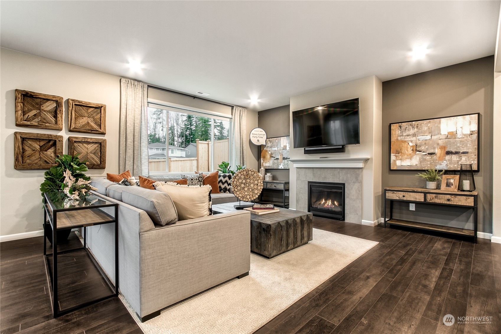 21116 42nd Drive Southeast, Unit 125 Bothell, WA 98021 - Photo 9 of 16 a living room with furniture a flat screen tv and a fireplace