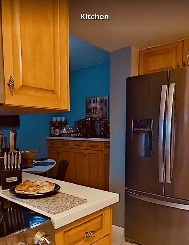 6372 La Costa Drive, Unit 705 Boca Raton, FL 33433 - Photo 13 of 60 a kitchen with stainless steel appliances granite countertop a refrigerator and a stove top oven
