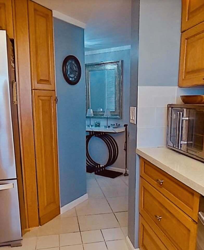 6372 La Costa Drive, Unit 705 Boca Raton, FL 33433 - Photo 19 of 60 a stove top oven sitting inside of a kitchen
