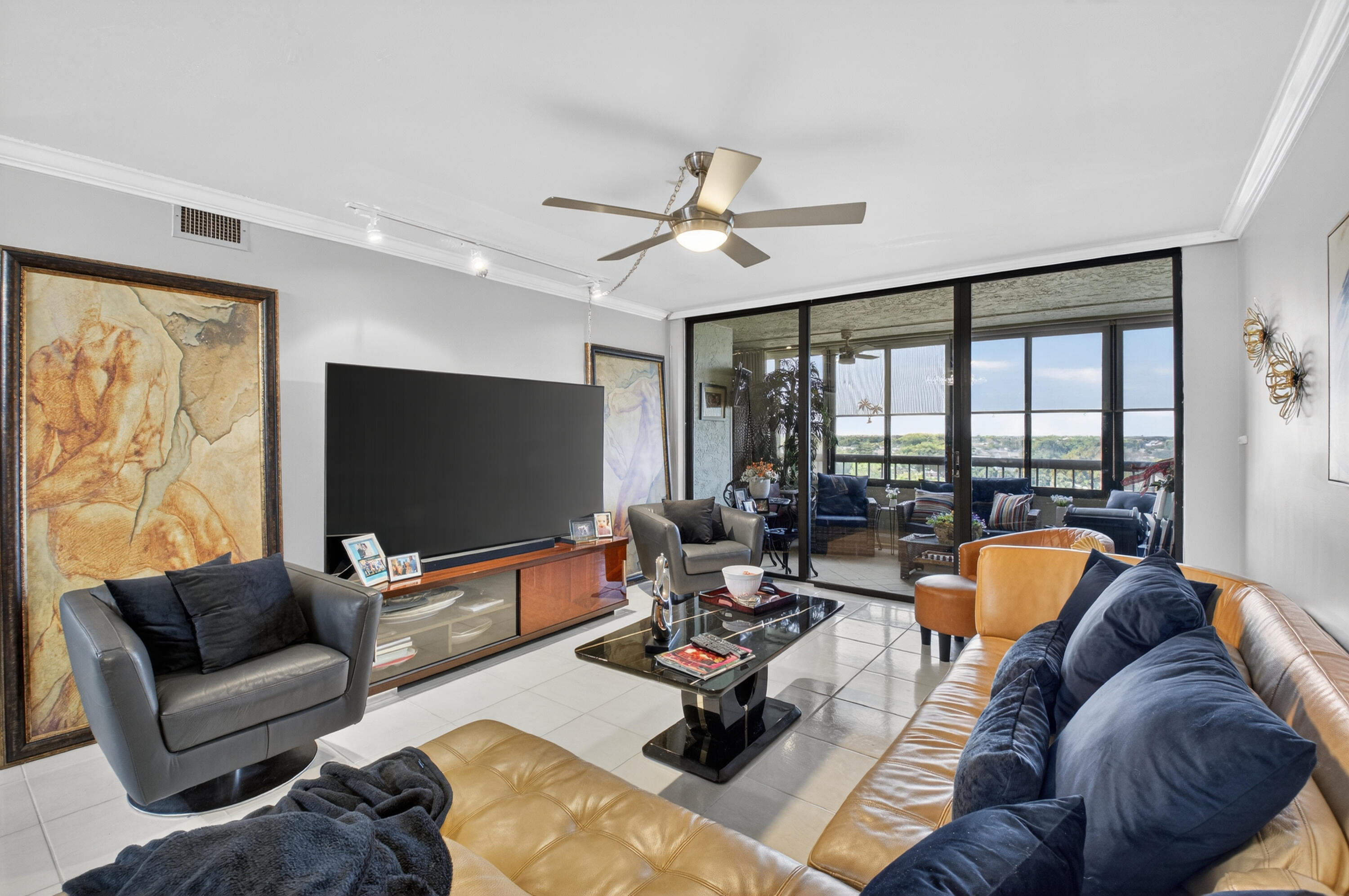 6372 La Costa Drive, Unit 705 Boca Raton, FL 33433 - Photo 2 of 60 a living room with furniture and a flat screen tv