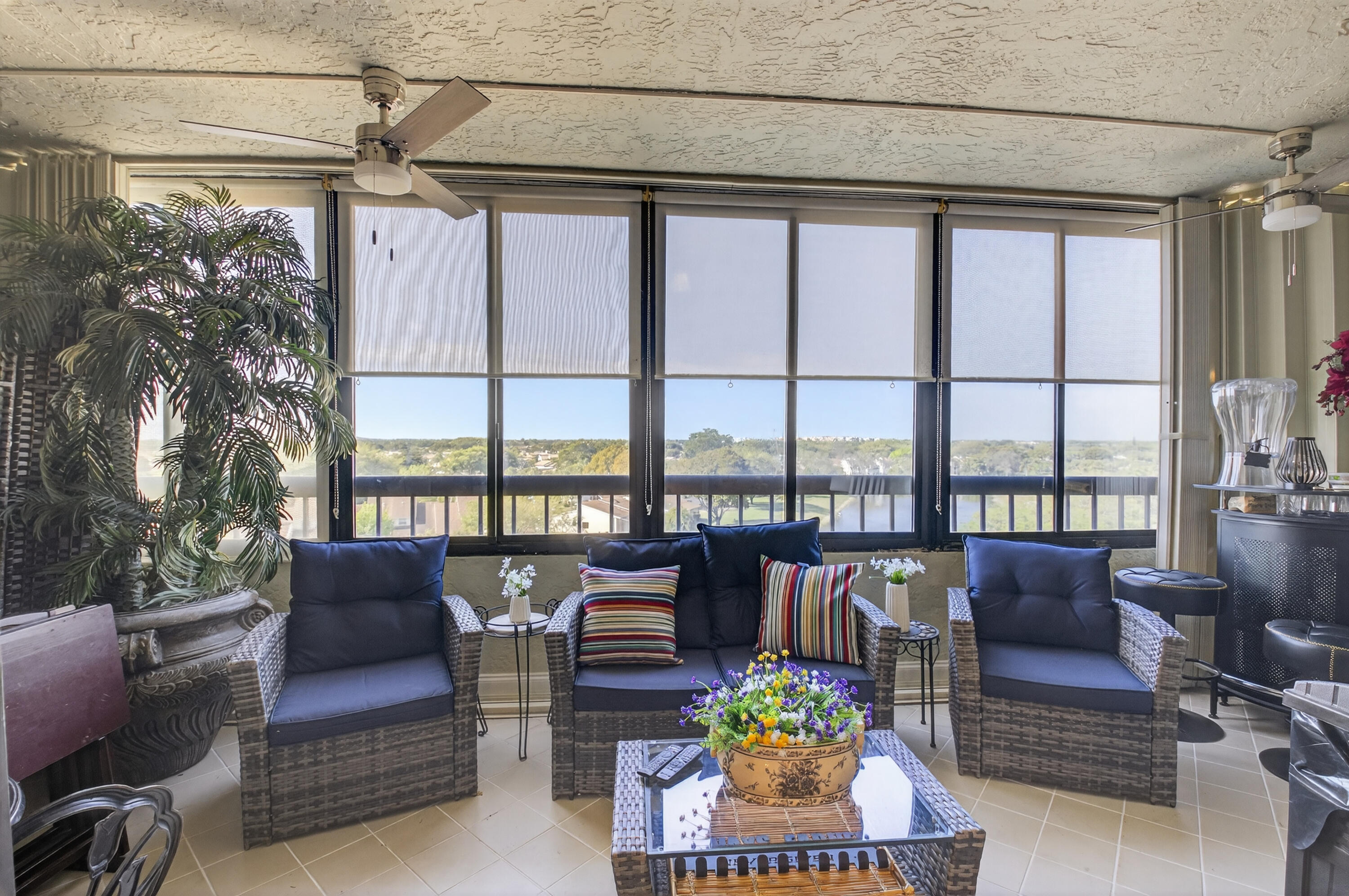 6372 La Costa Drive, Unit 705 Boca Raton, FL 33433 - Photo 22 of 60 a living room with furniture and floor to ceiling windows