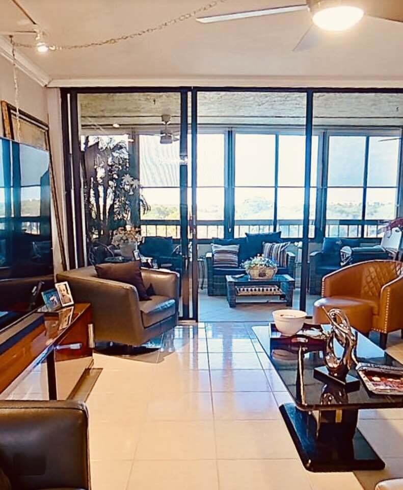 6372 La Costa Drive, Unit 705 Boca Raton, FL 33433 - Photo 24 of 60 a living room with furniture and a floor to ceiling window