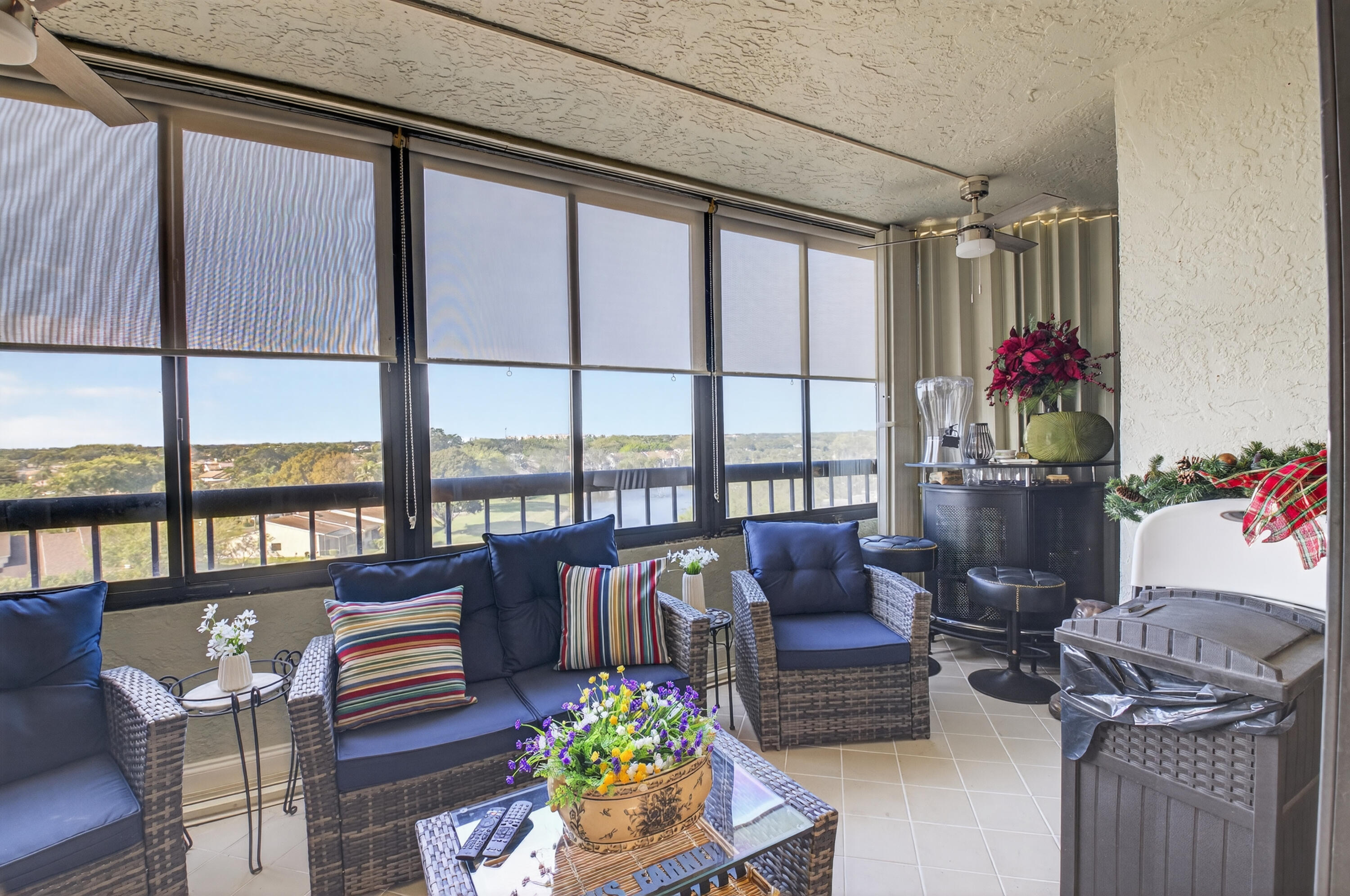 6372 La Costa Drive, Unit 705 Boca Raton, FL 33433 - Photo 28 of 60 a living room with furniture and a floor to ceiling window