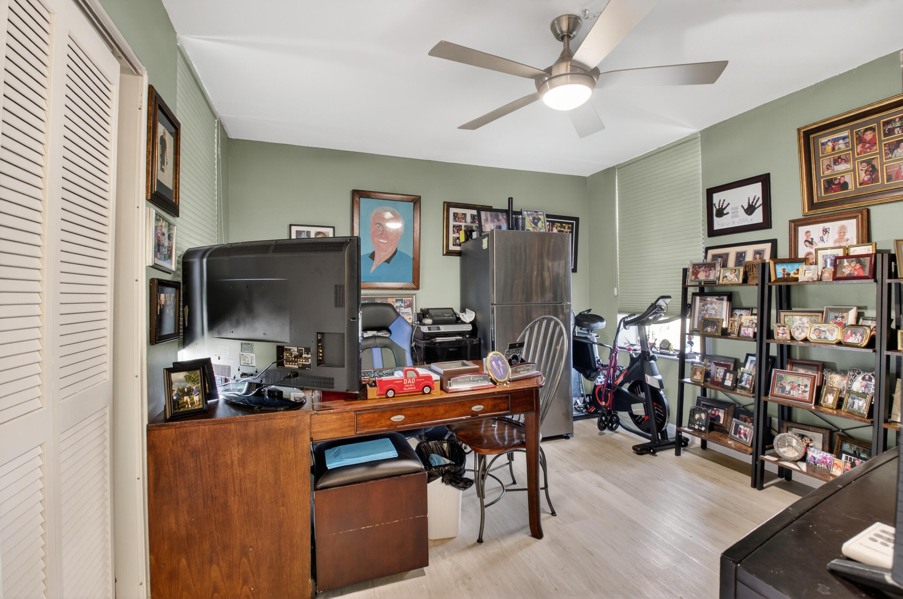 6372 La Costa Drive, Unit 705 Boca Raton, FL 33433 - Photo 29 of 60 a work room with furniture and a flat screen tv