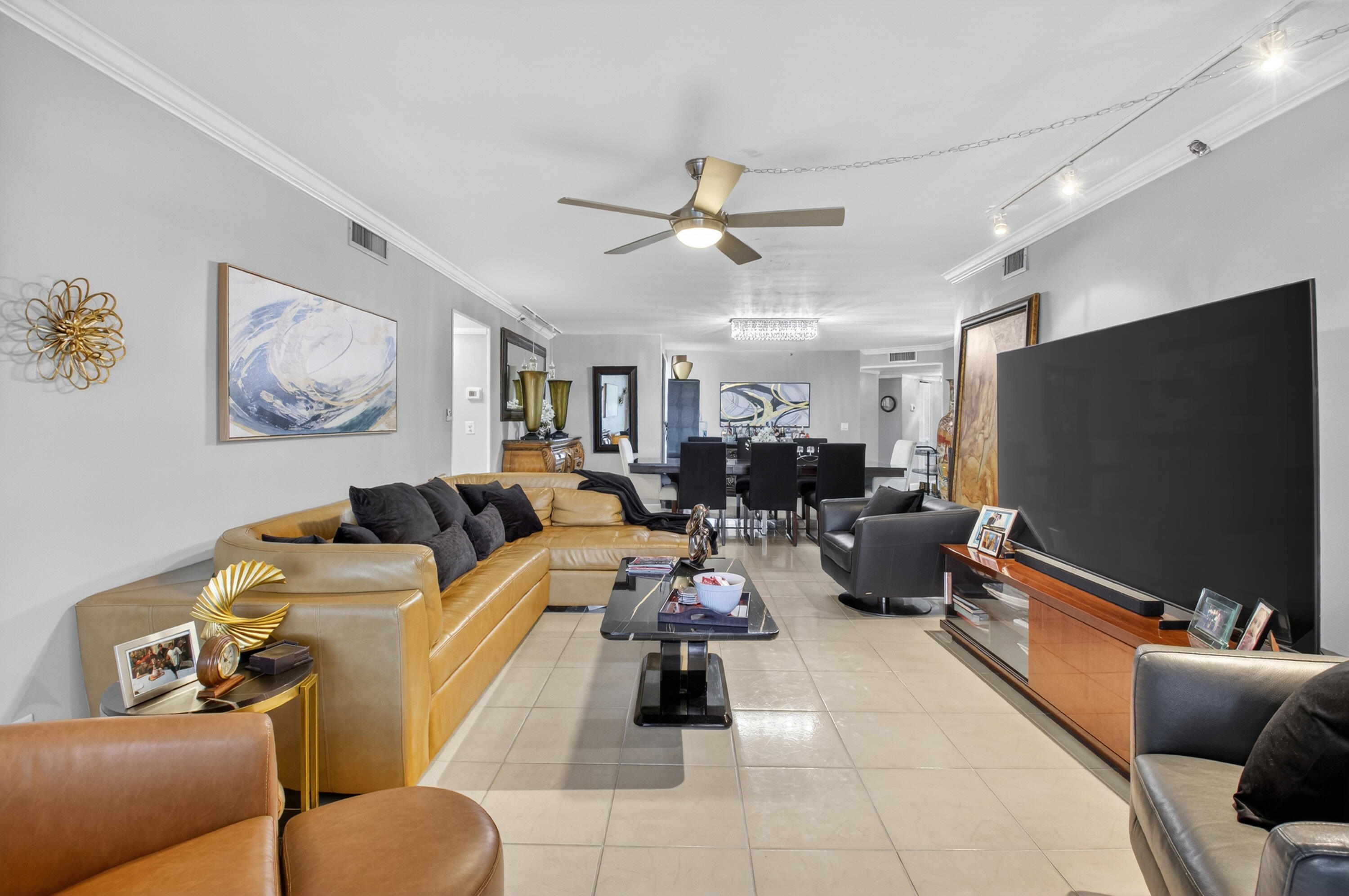 6372 La Costa Drive, Unit 705 Boca Raton, FL 33433 - Photo 3 of 60 a living room with furniture and a flat screen tv