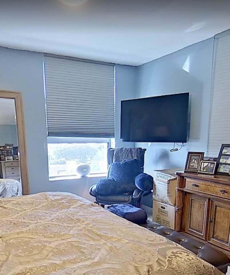 6372 La Costa Drive, Unit 705 Boca Raton, FL 33433 - Photo 33 of 60 a living room with furniture a flat screen tv and floor to ceiling window