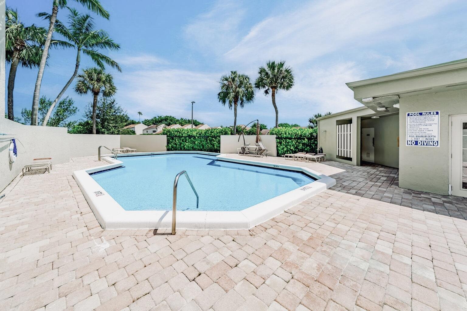 6372 La Costa Drive, Unit 705 Boca Raton, FL 33433 - Photo 47 of 60 a view of a swimming pool with a patio