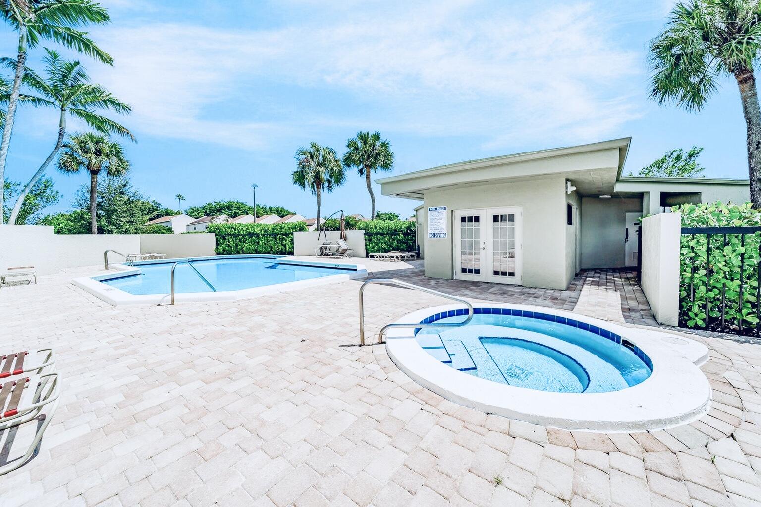 6372 La Costa Drive, Unit 705 Boca Raton, FL 33433 - Photo 48 of 60 a swimming pool with outdoor seating and yard