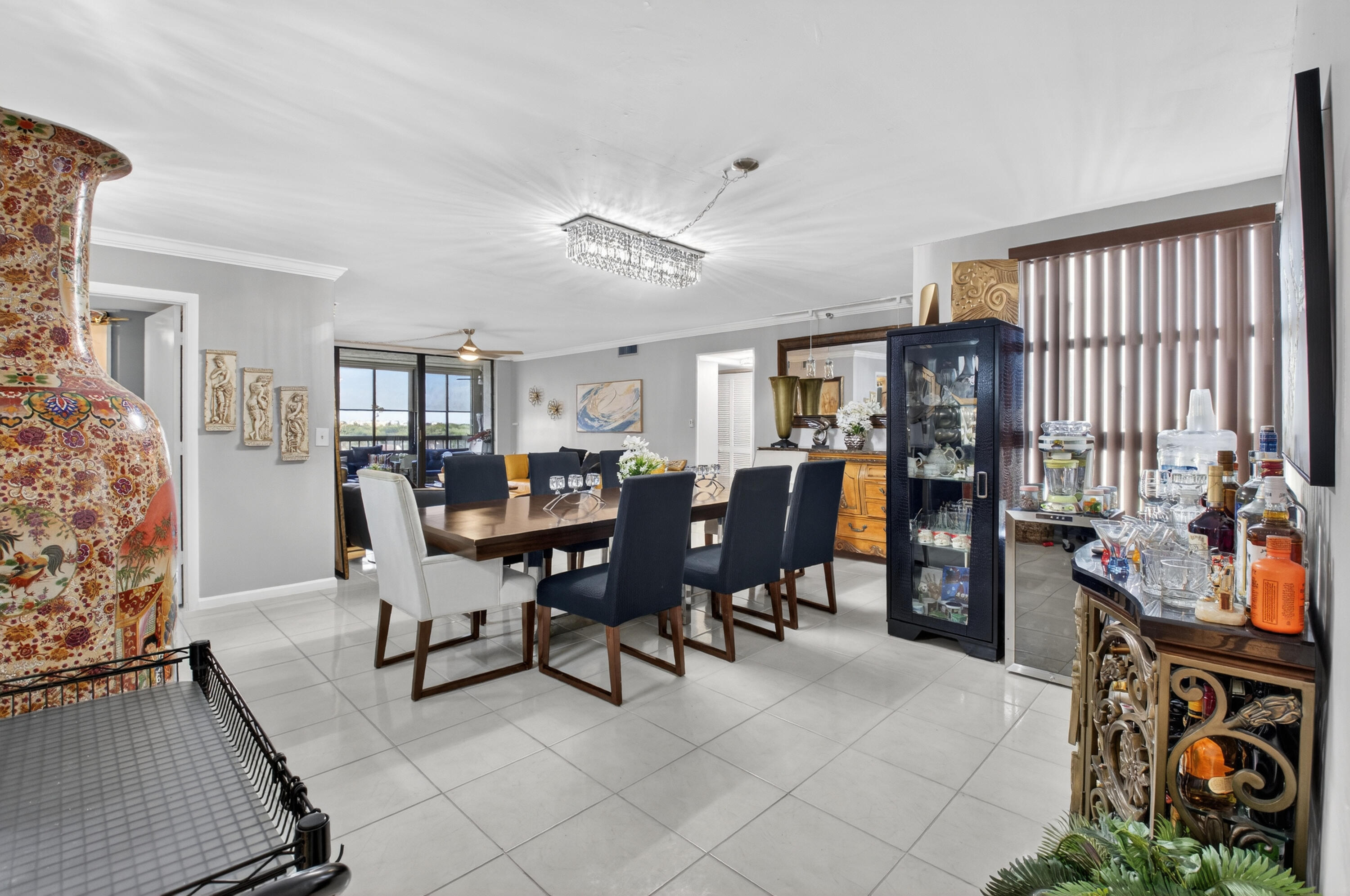 6372 La Costa Drive, Unit 705 Boca Raton, FL 33433 - Photo 5 of 60 a view of a dining room with furniture and a rug