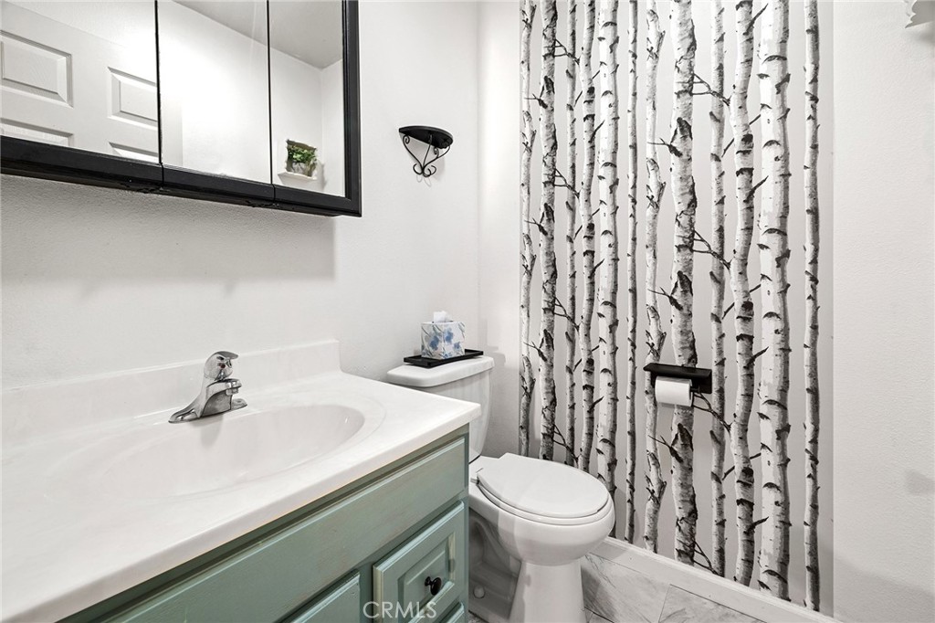 4 La Palma Drive Oroville, CA 95965 - Photo 14 of 39 a bathroom with a sink a toilet and shower curtain