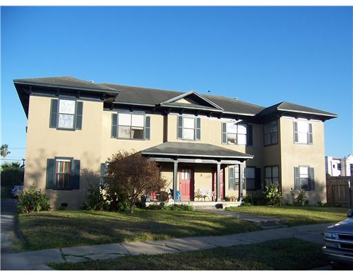 1224 2nd Street, Unit 1 Corpus Christi, TX 78404 - Photo 2 of 7 a front view of a house with a yard