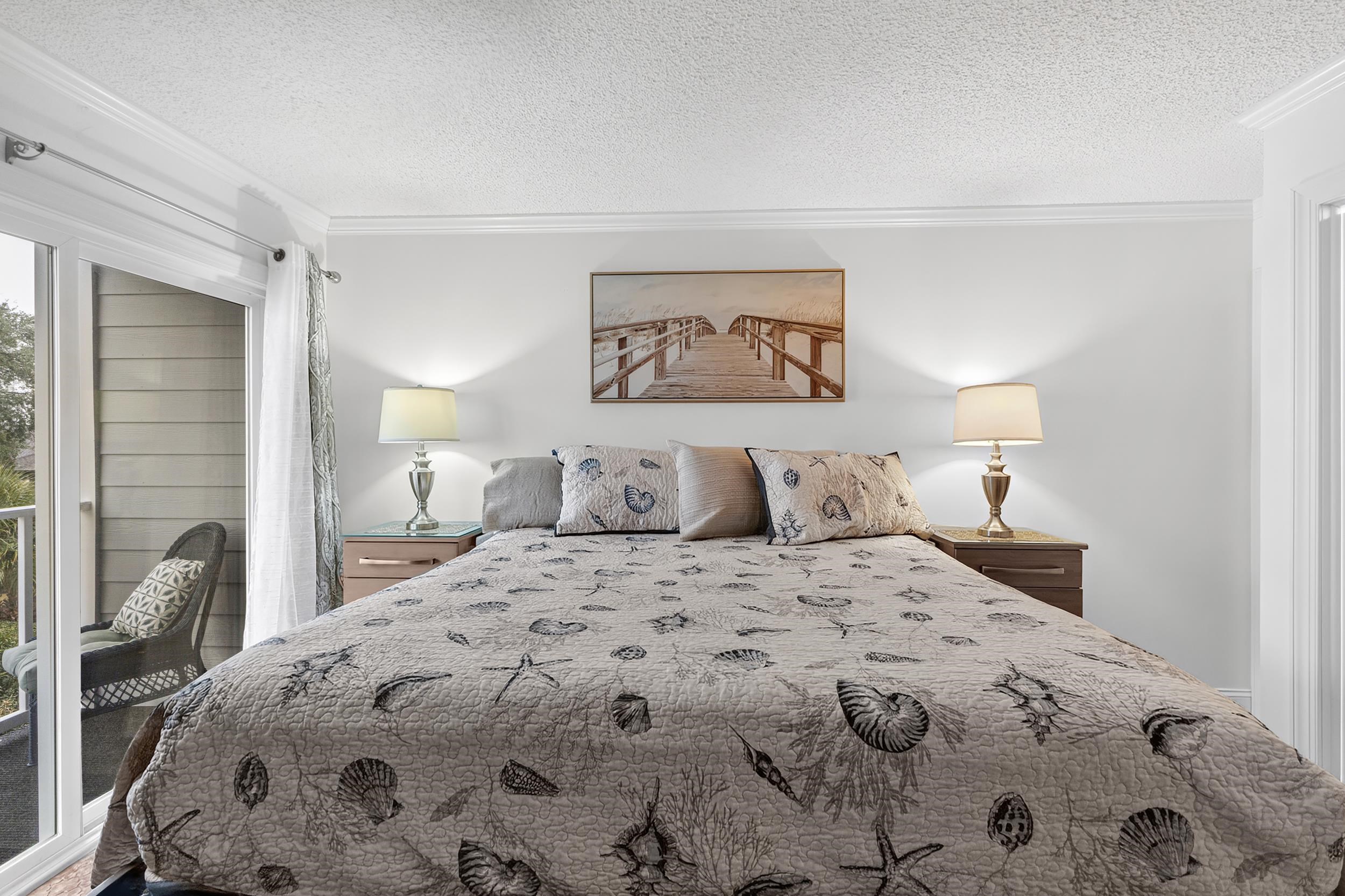 9581 Shore Drive, Unit 229 Myrtle Beach, SC 29572 - Photo 19 of 39 Bedroom with a textured ceiling and crown molding