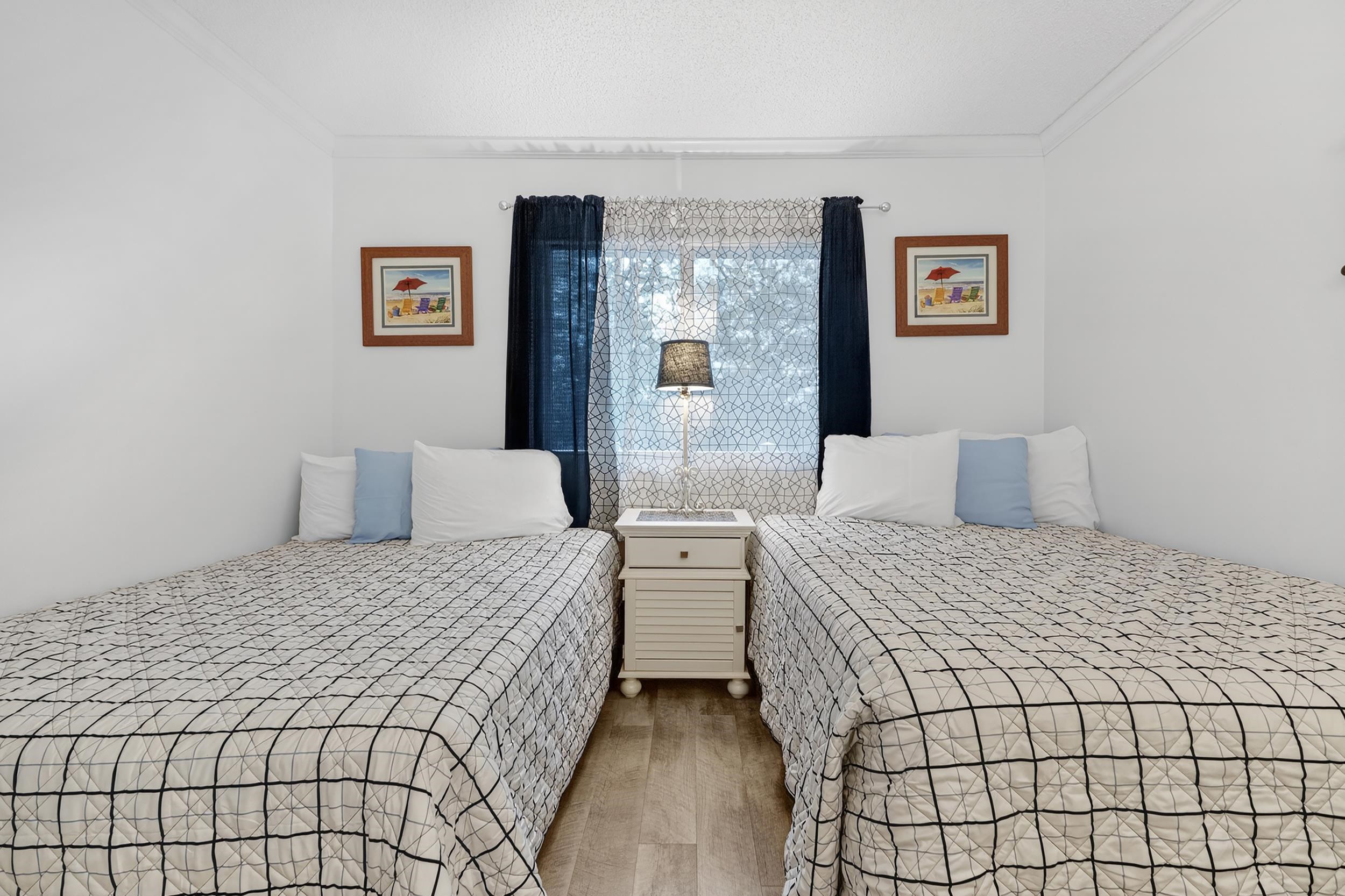 9581 Shore Drive, Unit 229 Myrtle Beach, SC 29572 - Photo 29 of 39 Bedroom featuring ornamental molding and wood finished floors