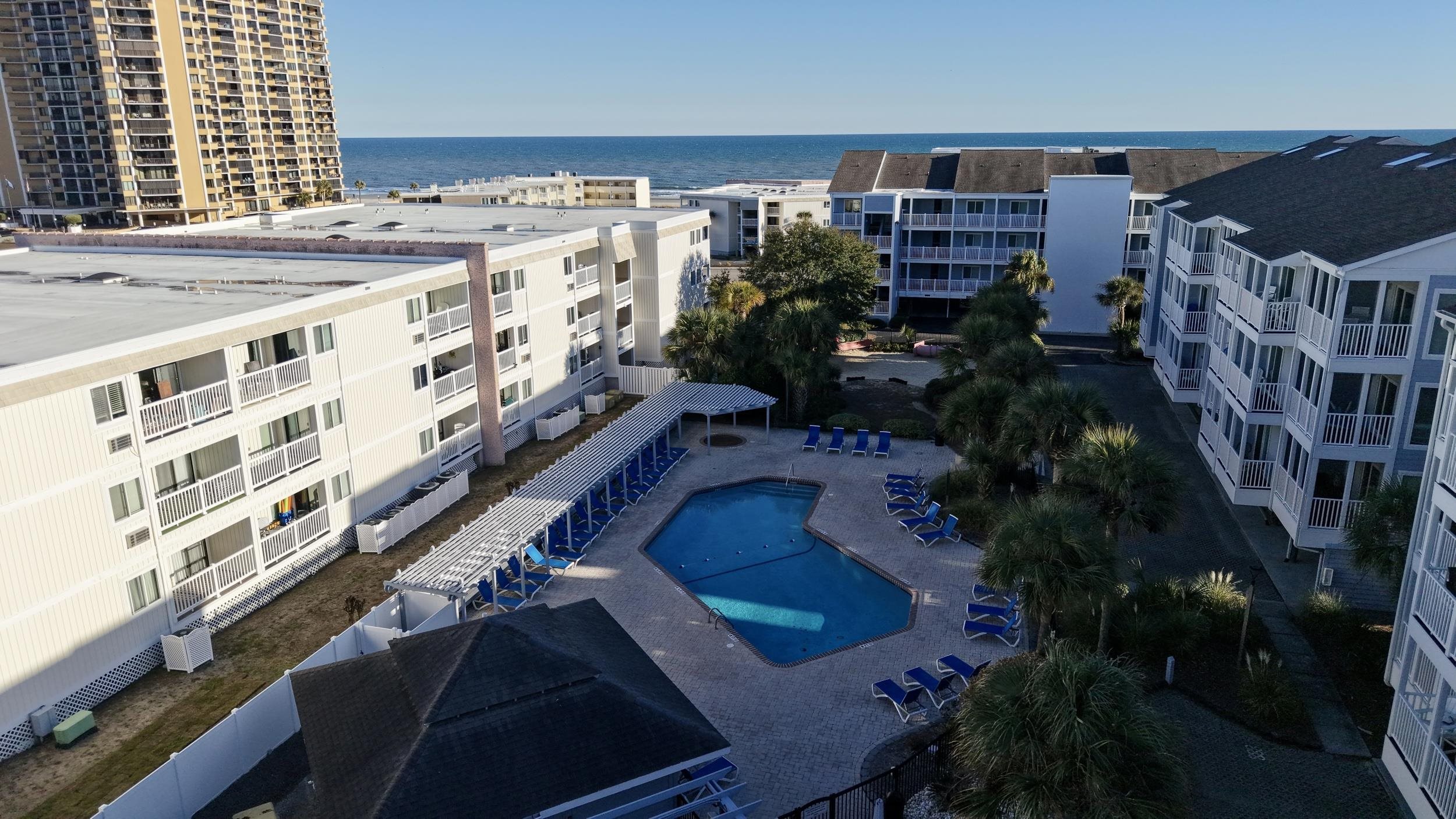 9581 Shore Drive, Unit 229 Myrtle Beach, SC 29572 - Photo 36 of 39 Community pool featuring a water view