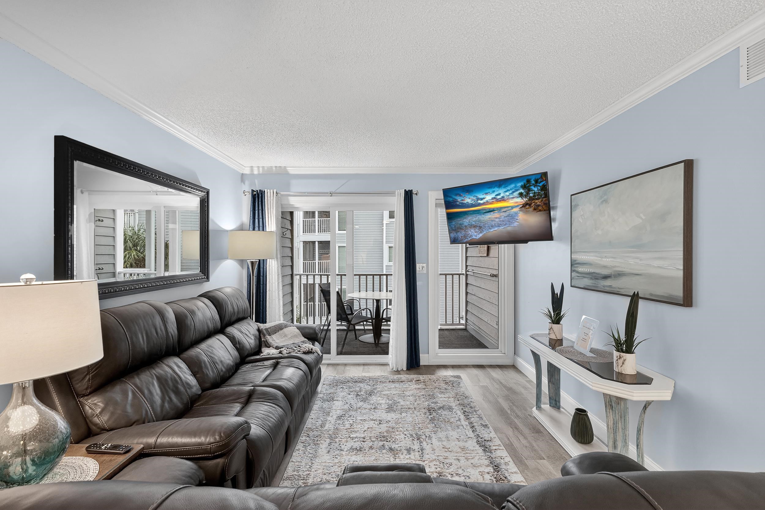 9581 Shore Drive, Unit 229 Myrtle Beach, SC 29572 - Photo 5 of 39 Living room with a textured ceiling, wood finished floors, and ornamental molding