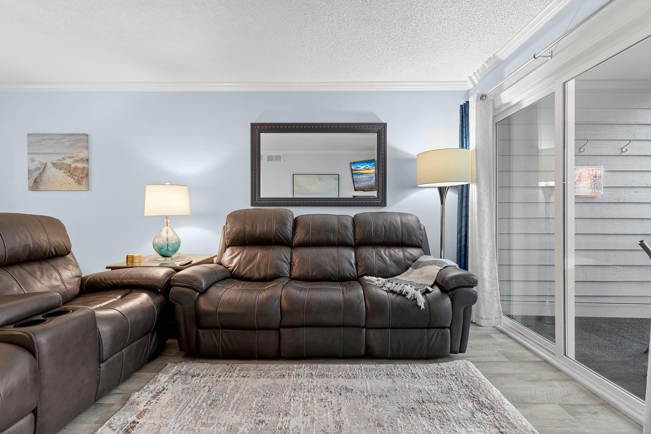 9581 Shore Drive, Unit 229 Myrtle Beach, SC 29572 - Photo 7 of 39 Living room featuring crown molding, wood finished floors, and a textured ceiling