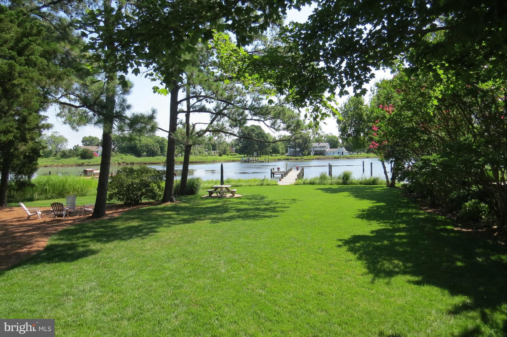 4889 Black Walnut Point Road Tilghman, MD 21671 - Photo 20 of 30 Yard with picnic area and firepit
