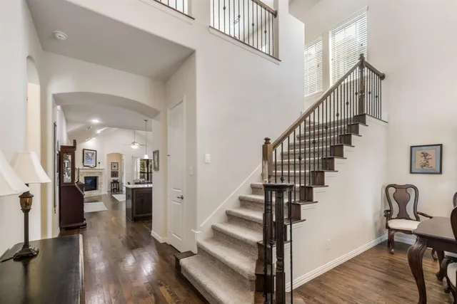 a view of entryway and hall with wooden floor