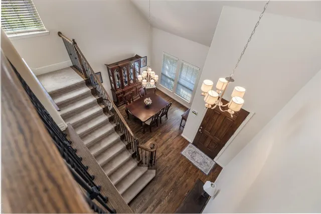 a view of living room with furniture and a chandelier