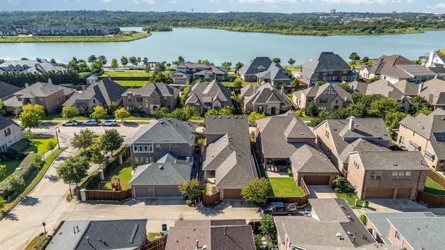 an aerial view of houses with outdoor space