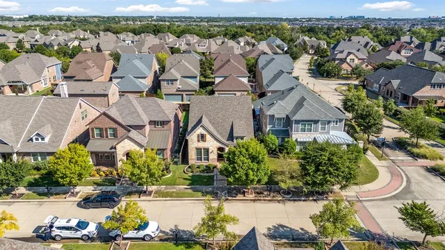 an aerial view of residential house with outdoor space and swimming pool