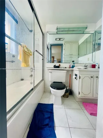 a kitchen with a sink a stove and cabinets