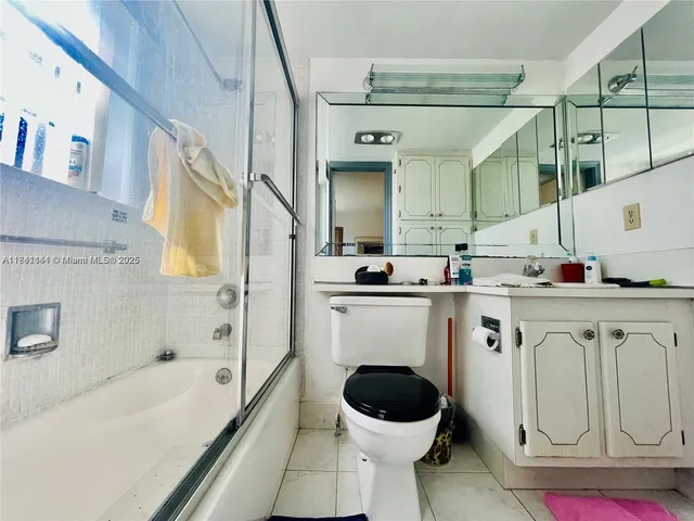 a bathroom with a sink a toilet and bathtub