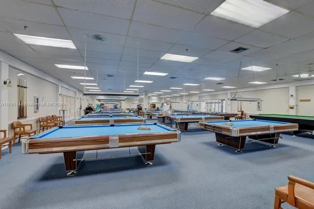 a room with furniture and pool table